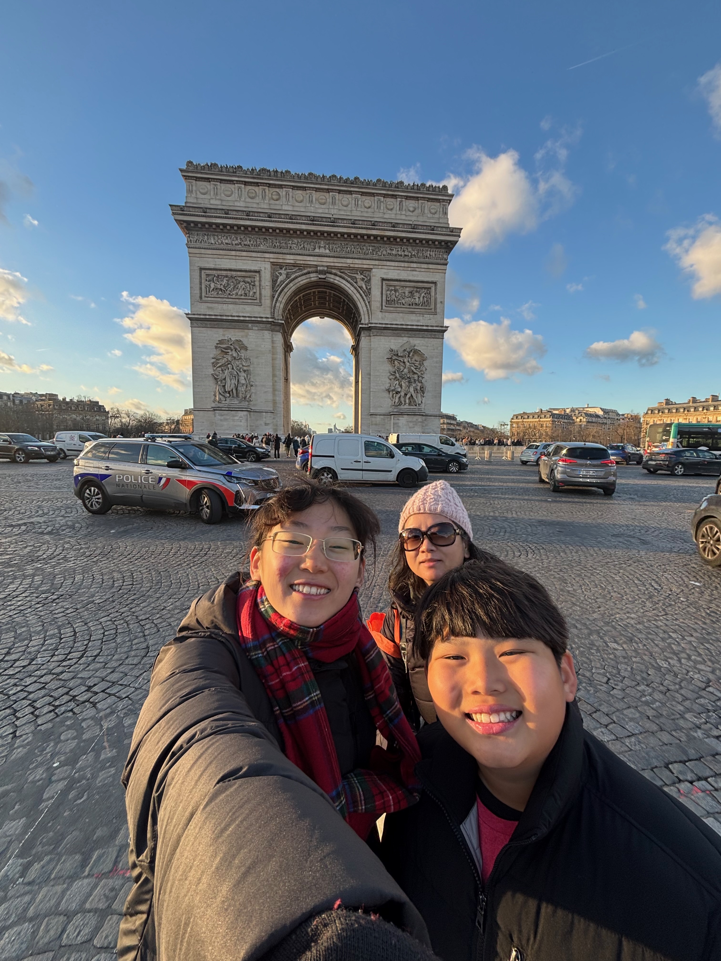Taking point-fives at the Arc de Triomphe with my mom and my brother